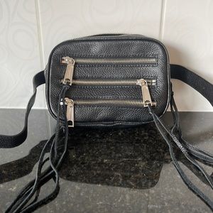 REBECCA MINKOFF leather fanny pack. Adjustable leather strap. Silver accents.